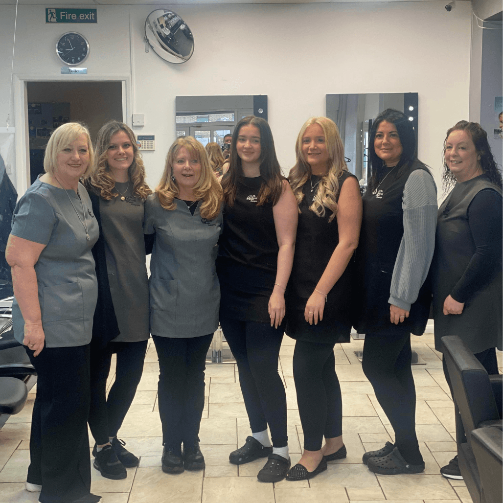 The Classic Hair Company team of stylists standing together in the Tilbury salon.