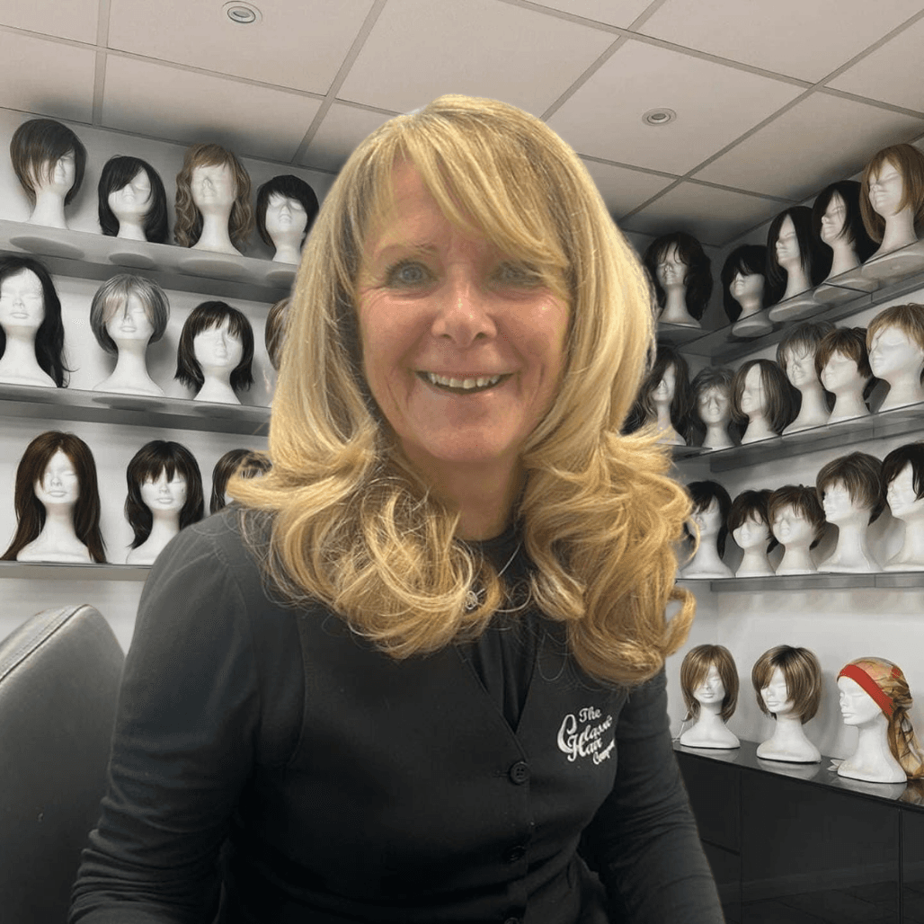 Debbie Wiseman at The Classic Hair Company in Tilbury, Essex, expert wig fitter pictured in the salon wig room surrounded by natural wigs.