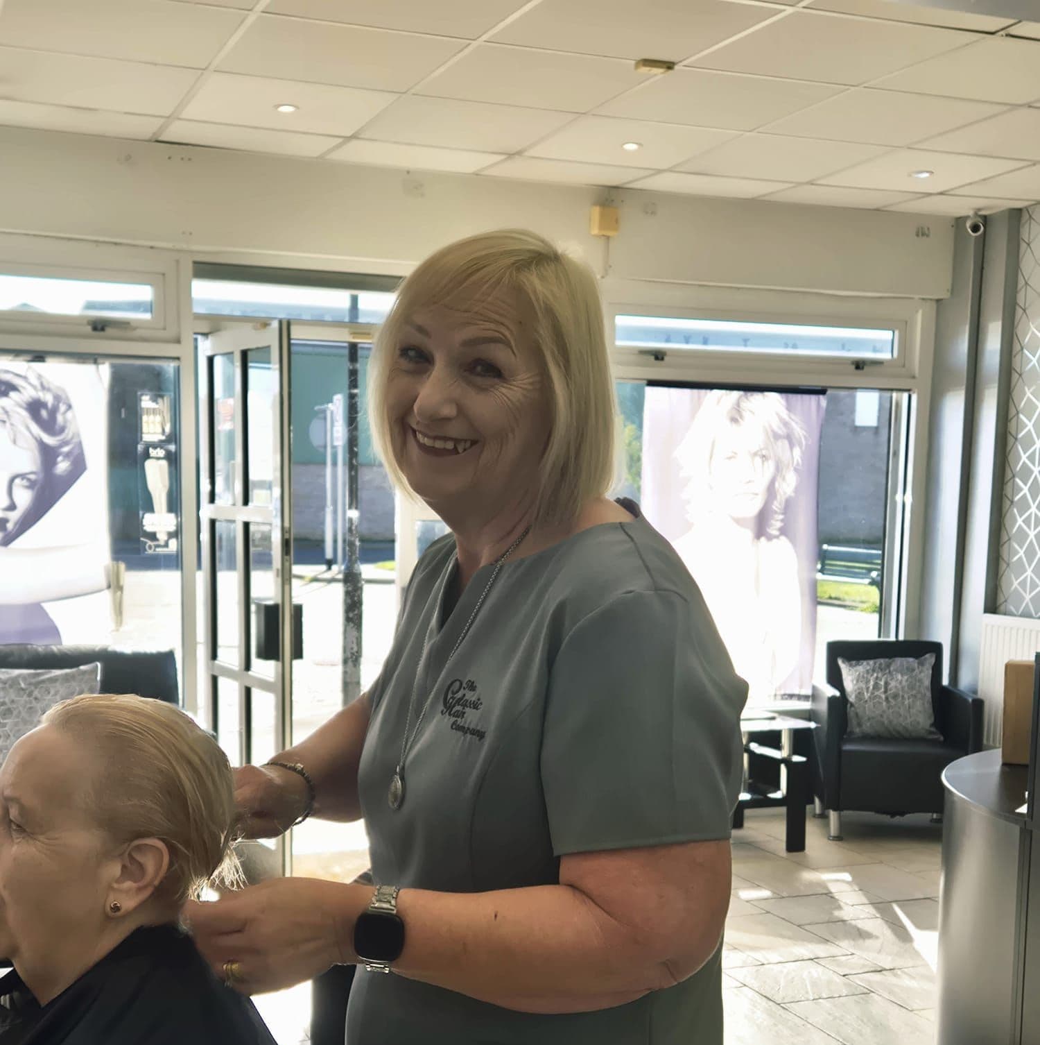 Smiling woman, Edna Kemp Advanced Stylist at The Classic Hair Company in Tilbury, Essex.