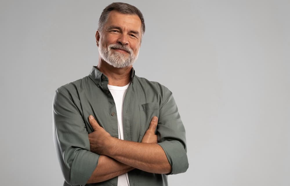 Mature man with neatly trimmed short haircut and beard