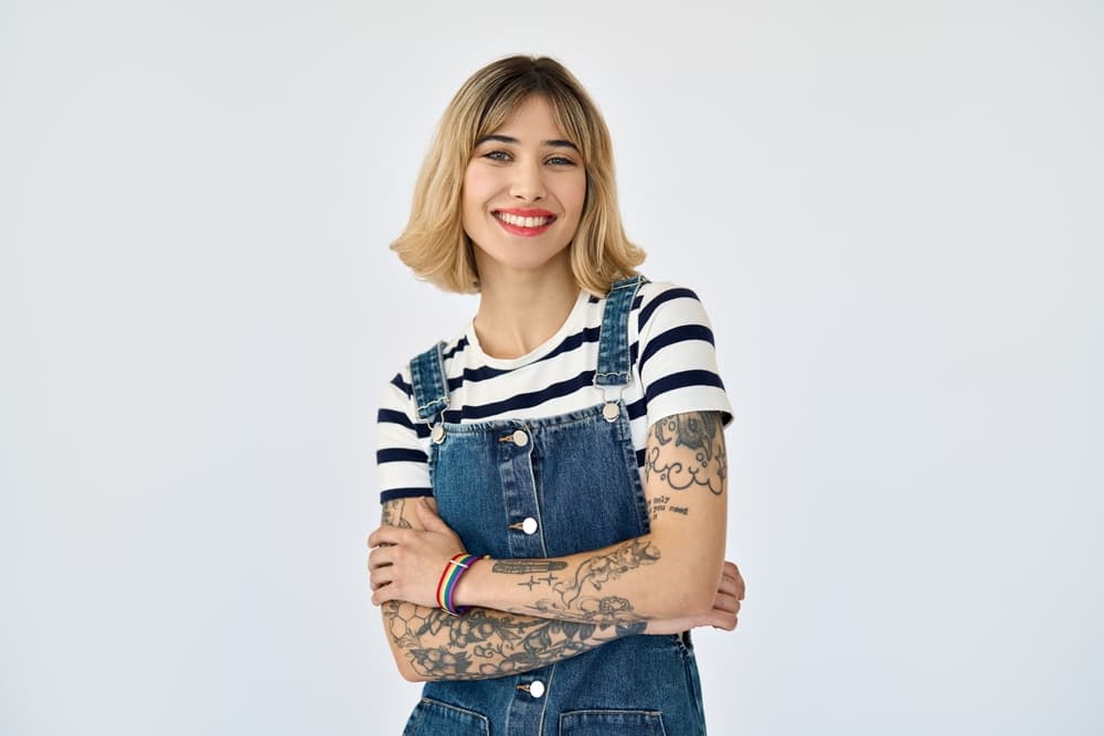 Young woman with blonde bob smiling after fresh hair trim